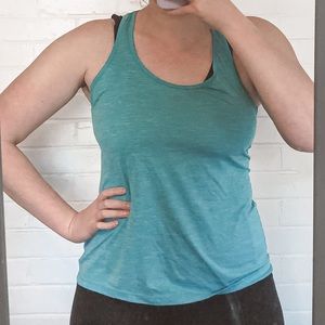 Teal athletic tank top with strappy back.